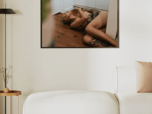 Limited-edition fine art nude print of Madam Sophie, showcasing tattoos and raw elegance on premium Photorag paper.