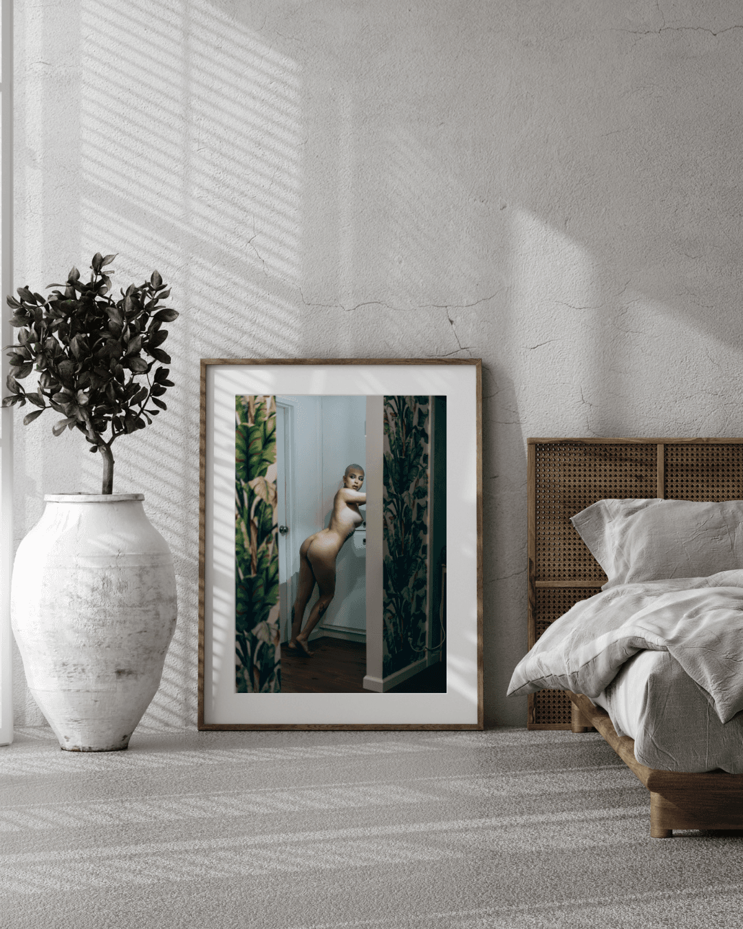Elegant fine art nude print of Madam Sophie in a Los Angeles hallway, highlighting her confident silhouette and vibrant tropical background.